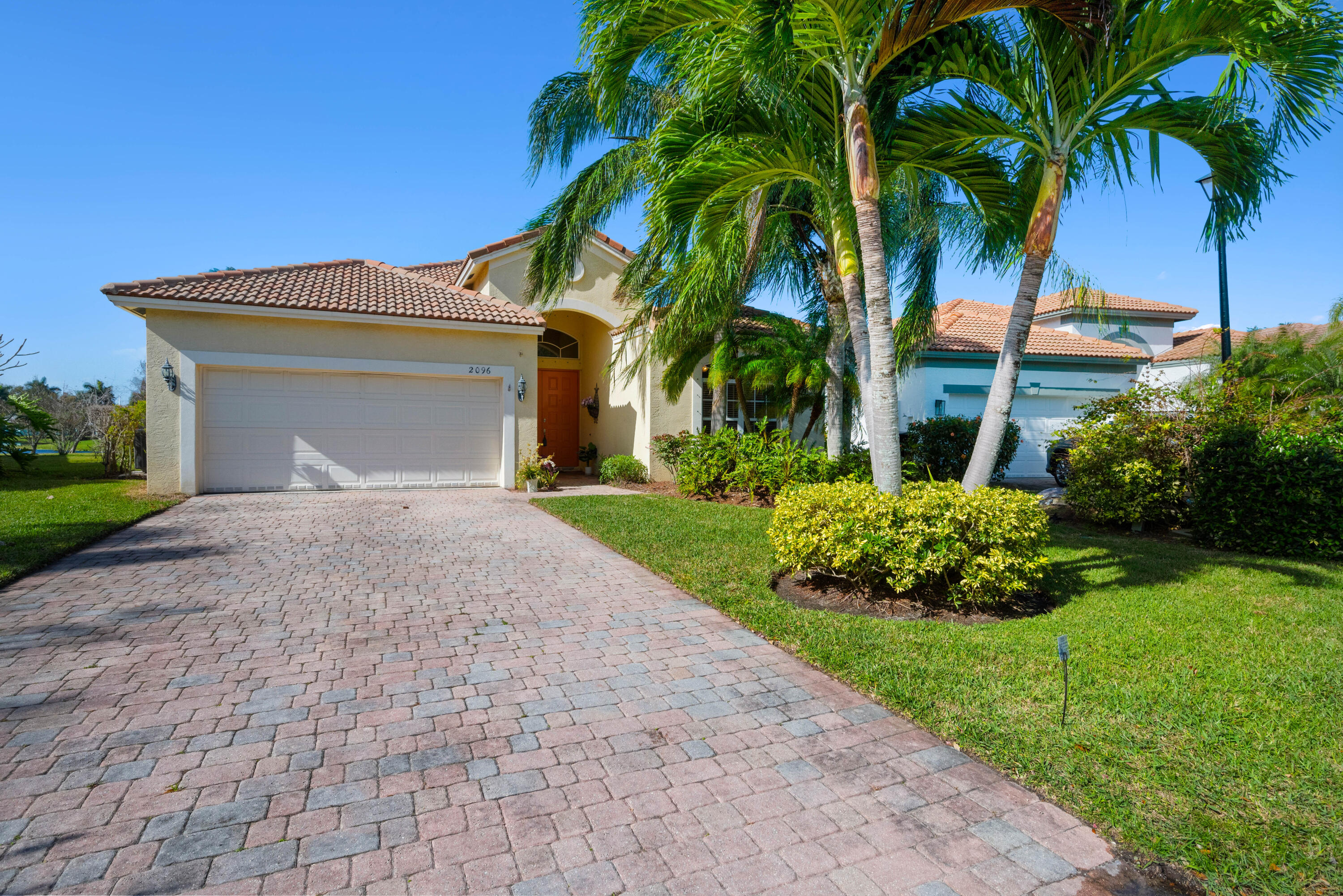2096 Northwest Marsh Rabbit Lane Jensen Beach, FL 34957 - Photo 16 of 38 a front view of house with yard and green space