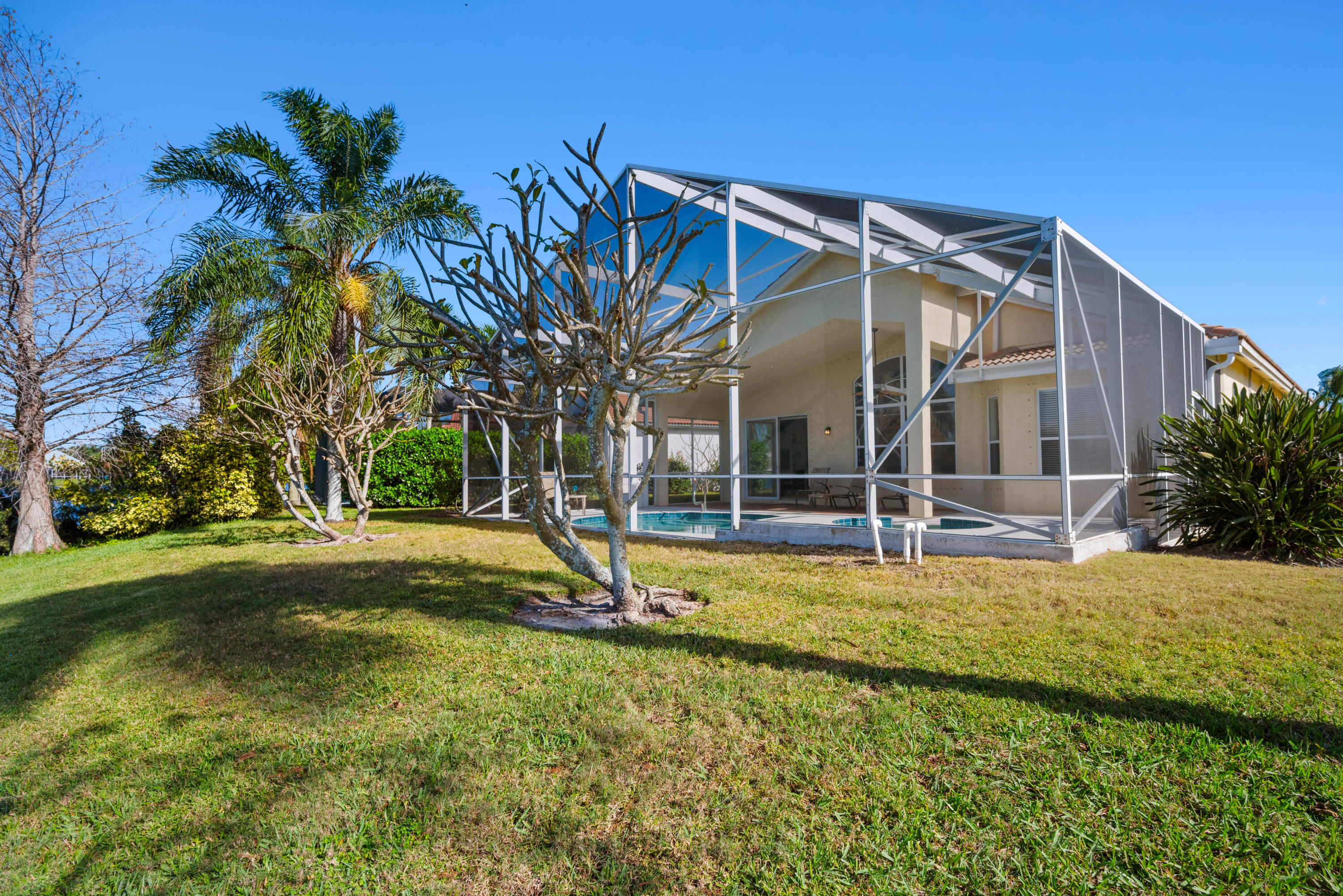 2096 Northwest Marsh Rabbit Lane Jensen Beach, FL 34957 - Photo 35 of 38 a view of a house with swimming pool and sitting area