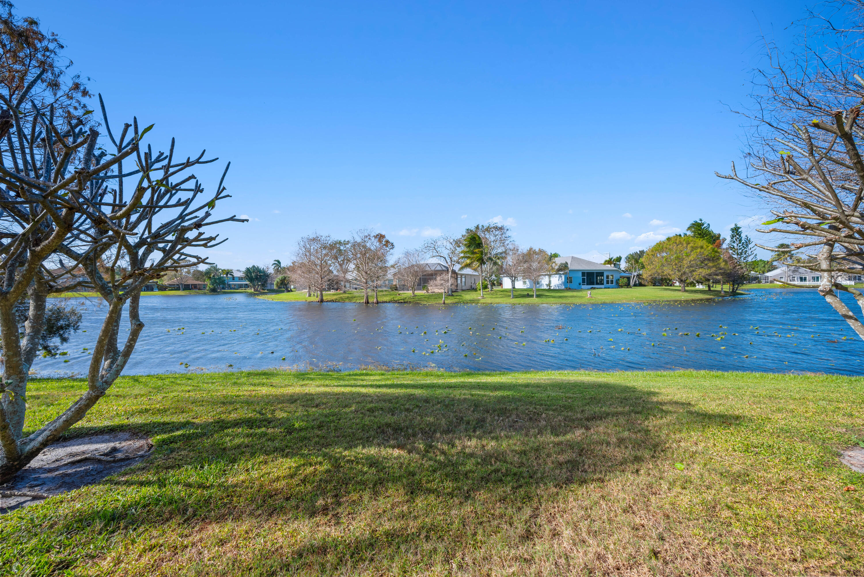 2096 Northwest Marsh Rabbit Lane Jensen Beach, FL 34957 - Photo 36 of 38 a view of yard with swimming pool and seating area