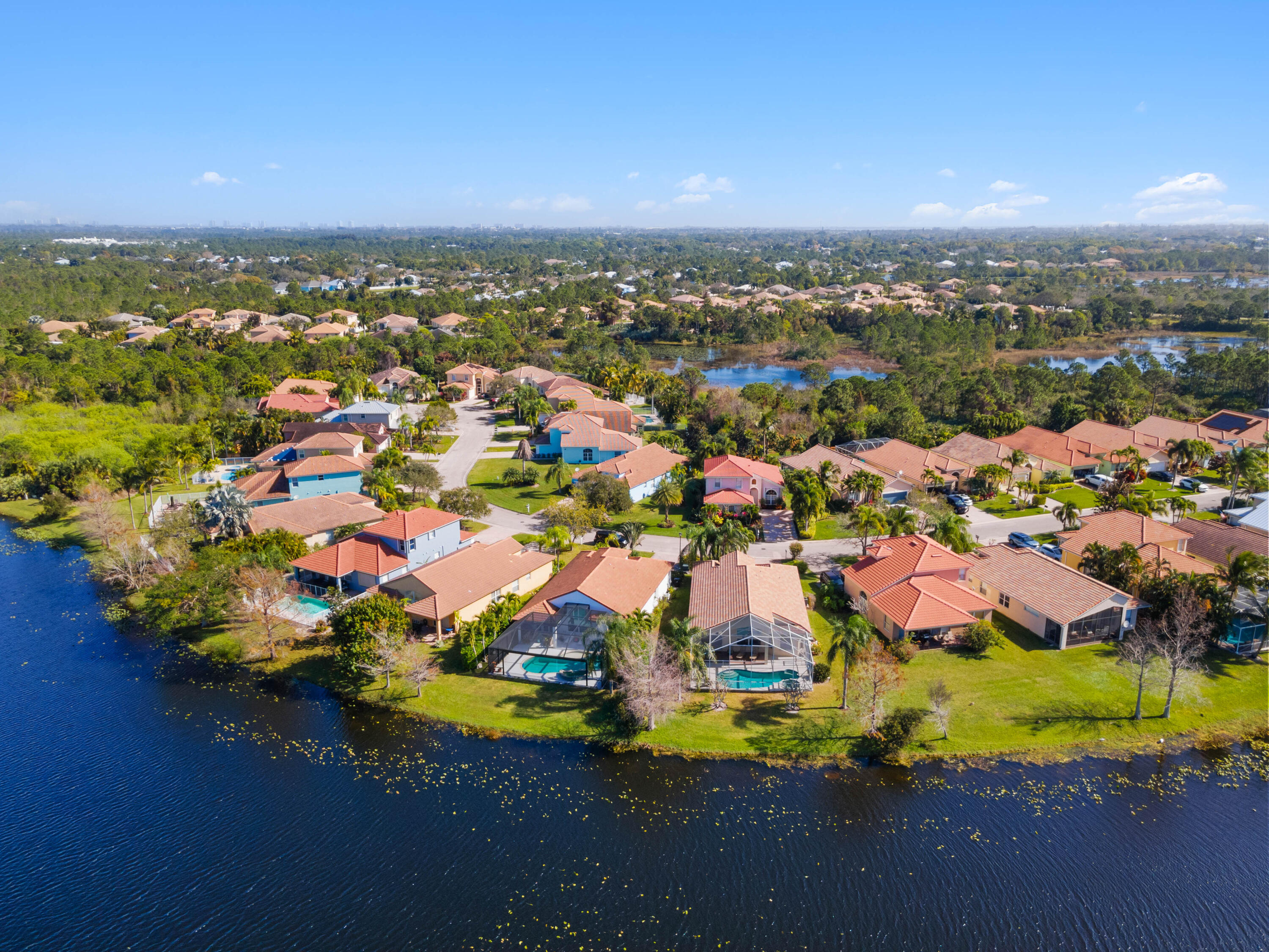 2096 Northwest Marsh Rabbit Lane Jensen Beach, FL 34957 - Photo 38 of 38 an aerial view of residential houses with outdoor space and swimming pool