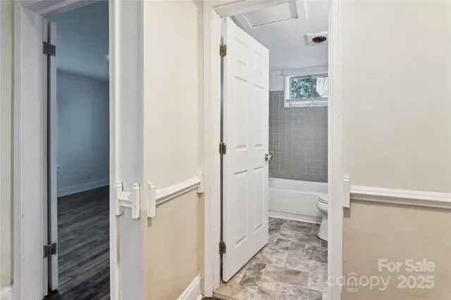a bathroom with a tub and shower