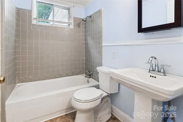 a bathroom with a sink toilet and bathtub