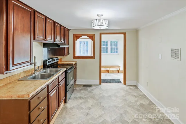 a kitchen that has a lot of cabinets in it