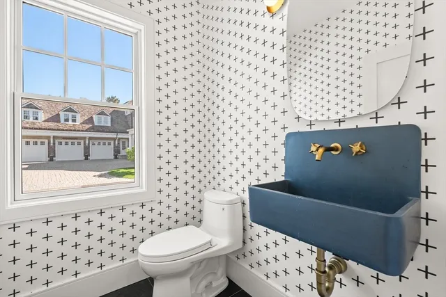 a bathroom with a toilet and a shower curtain