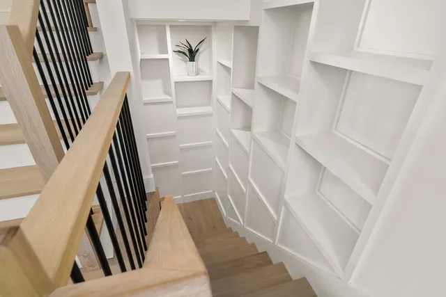 a view of an entryway with wooden floor