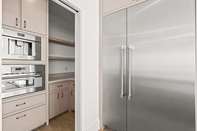 a kitchen with cabinets and window