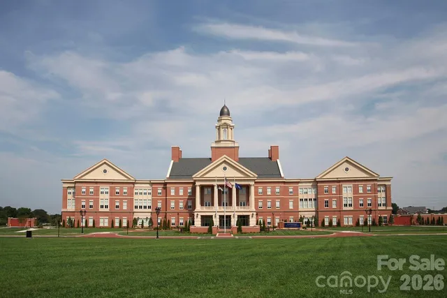 a view of a swimming pool with lawn chairs