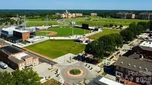 an outdoor space with swimming pool and trees