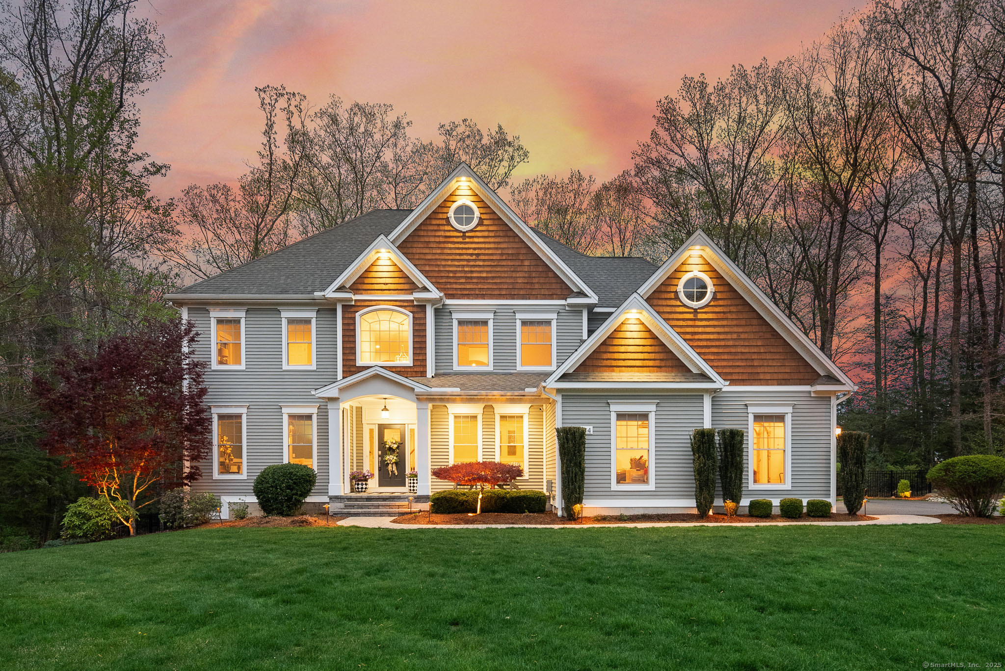 94 Alpine Drive Burlington, CT 06013 - Photo 1 of 1 a front view of a house with a yard table and chairs