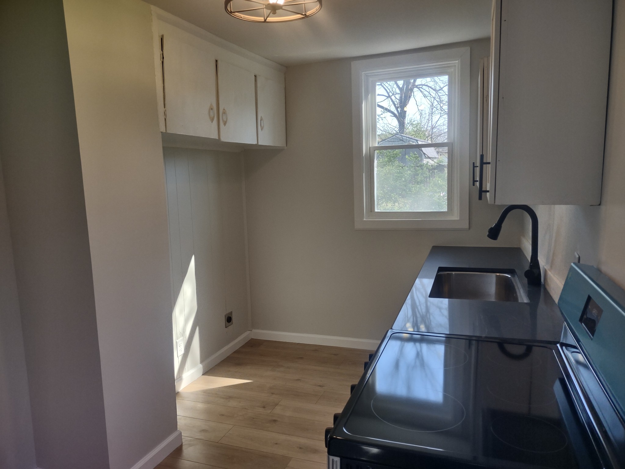 143 Morrison Street, Unit 3 Gallatin, TN 37066 - Photo 3 of 11 a kitchen with sink and window
