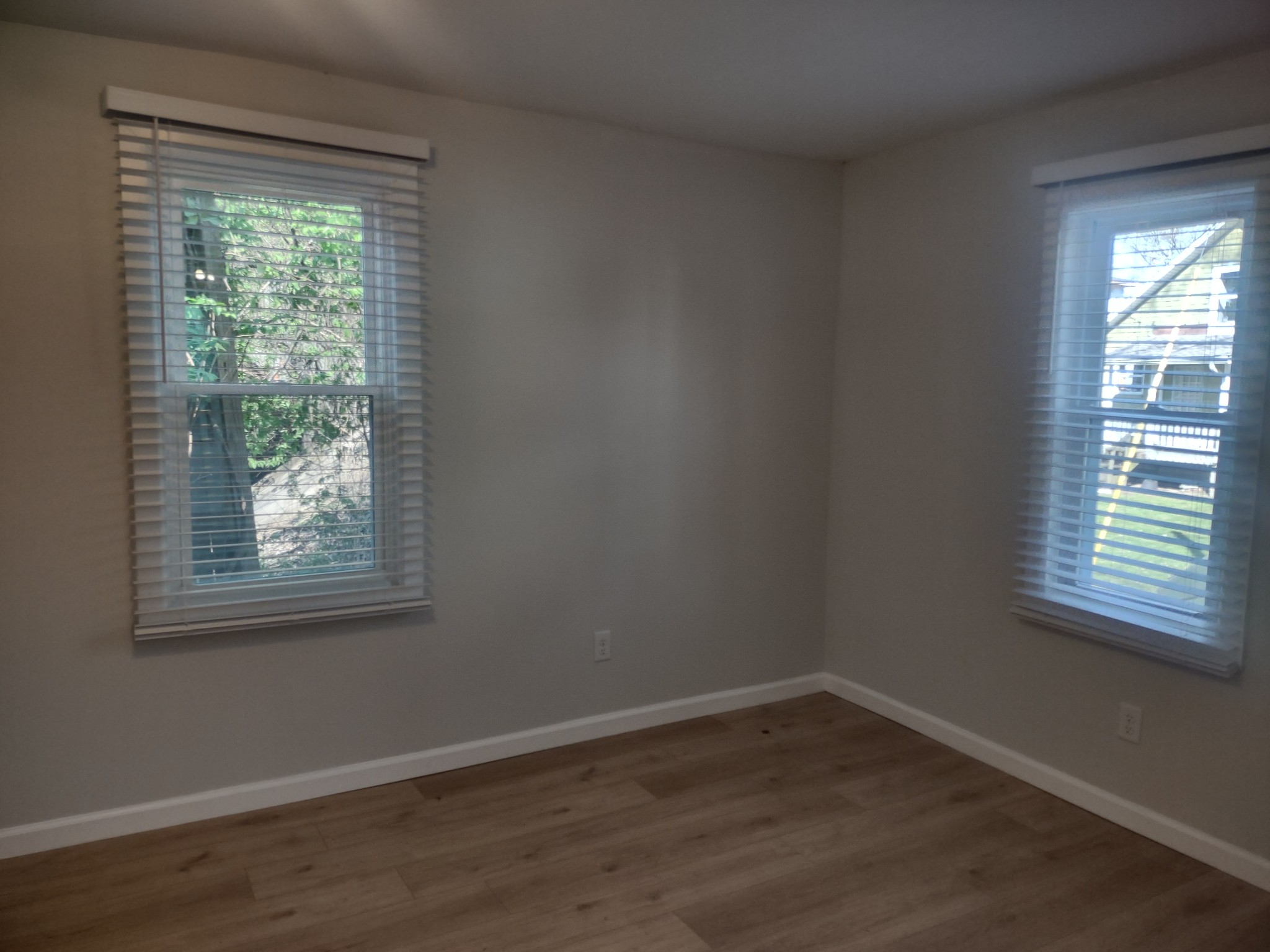 143 Morrison Street, Unit 3 Gallatin, TN 37066 - Photo 5 of 11 a view of an empty room with wooden floor and a window