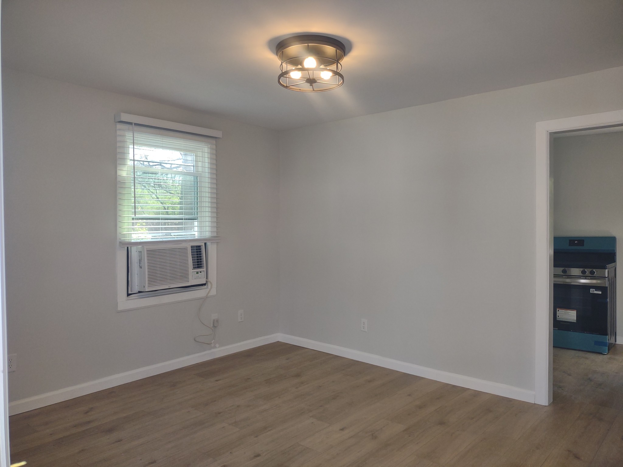 143 Morrison Street, Unit 3 Gallatin, TN 37066 - Photo 6 of 11 a view of a windows and chandelier fan in a room