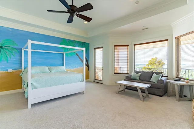 a bedroom with a bed and a television