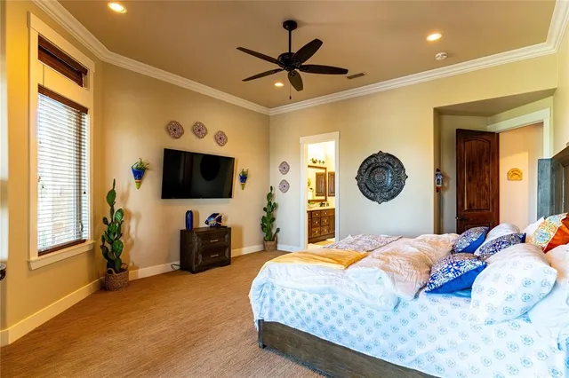 a bed room with a bed and a large window