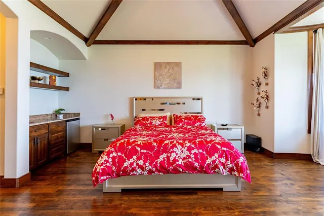 a bedroom with a bed and a couch