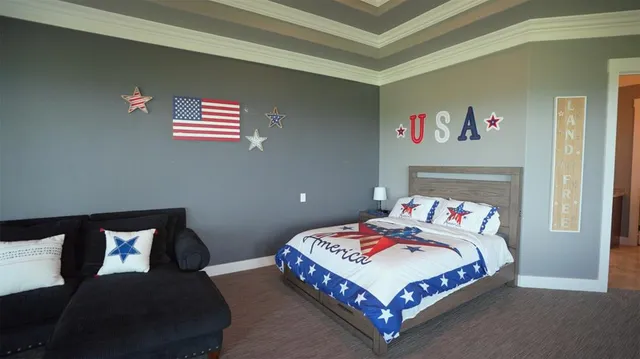 a bedroom with furniture and a window