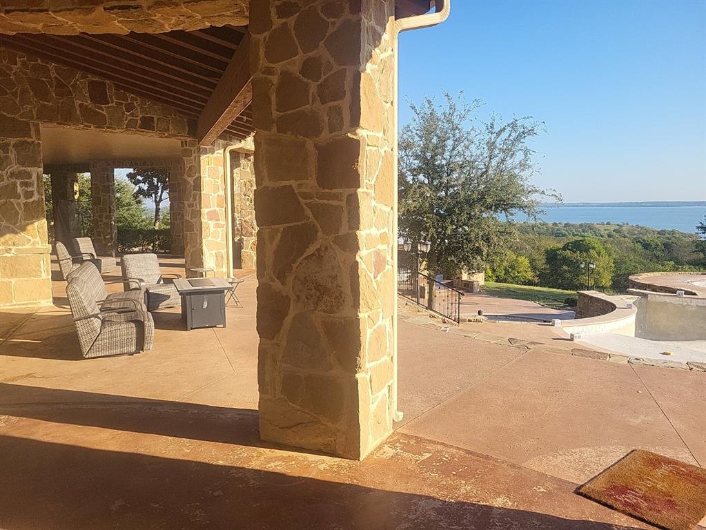 1180 McReynolds Road Sanger, TX 76266 - Photo 29 of 36 a view of a patio with dining table and chairs