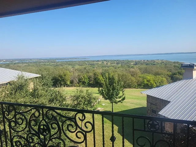a view of a balcony with wooden floor