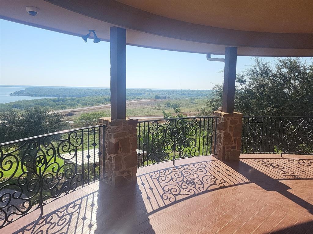 1180 McReynolds Road Sanger, TX 76266 - Photo 33 of 36 a view of a balcony with wooden floor