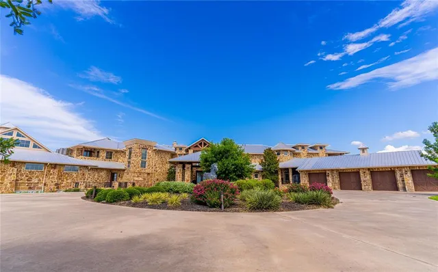 a front view of a building with a yard