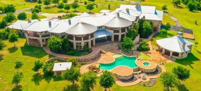 an aerial view of a swimming pool and outdoor space