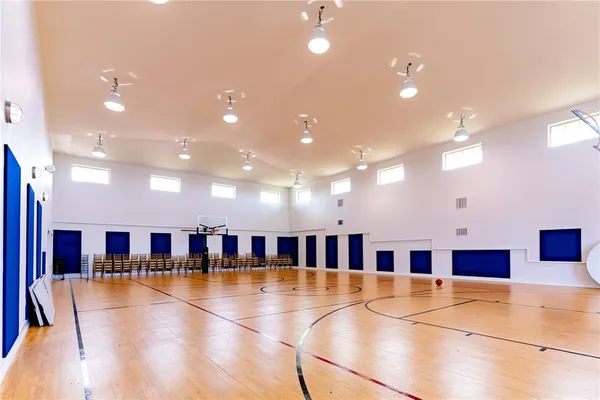 a room with furniture projector and screen