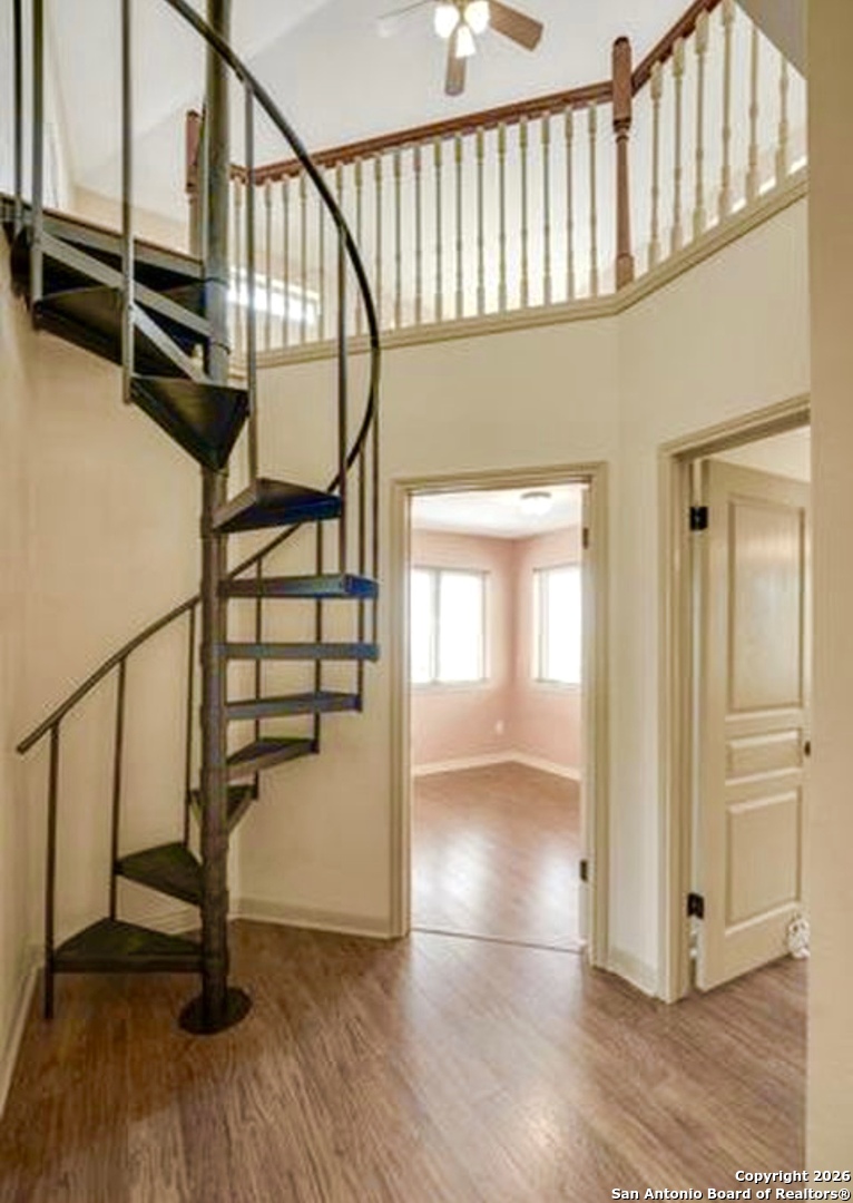 9623 Requa Road Helotes, TX 78023 - Photo 23 of 49 a view of entryway with wooden floor and stairs