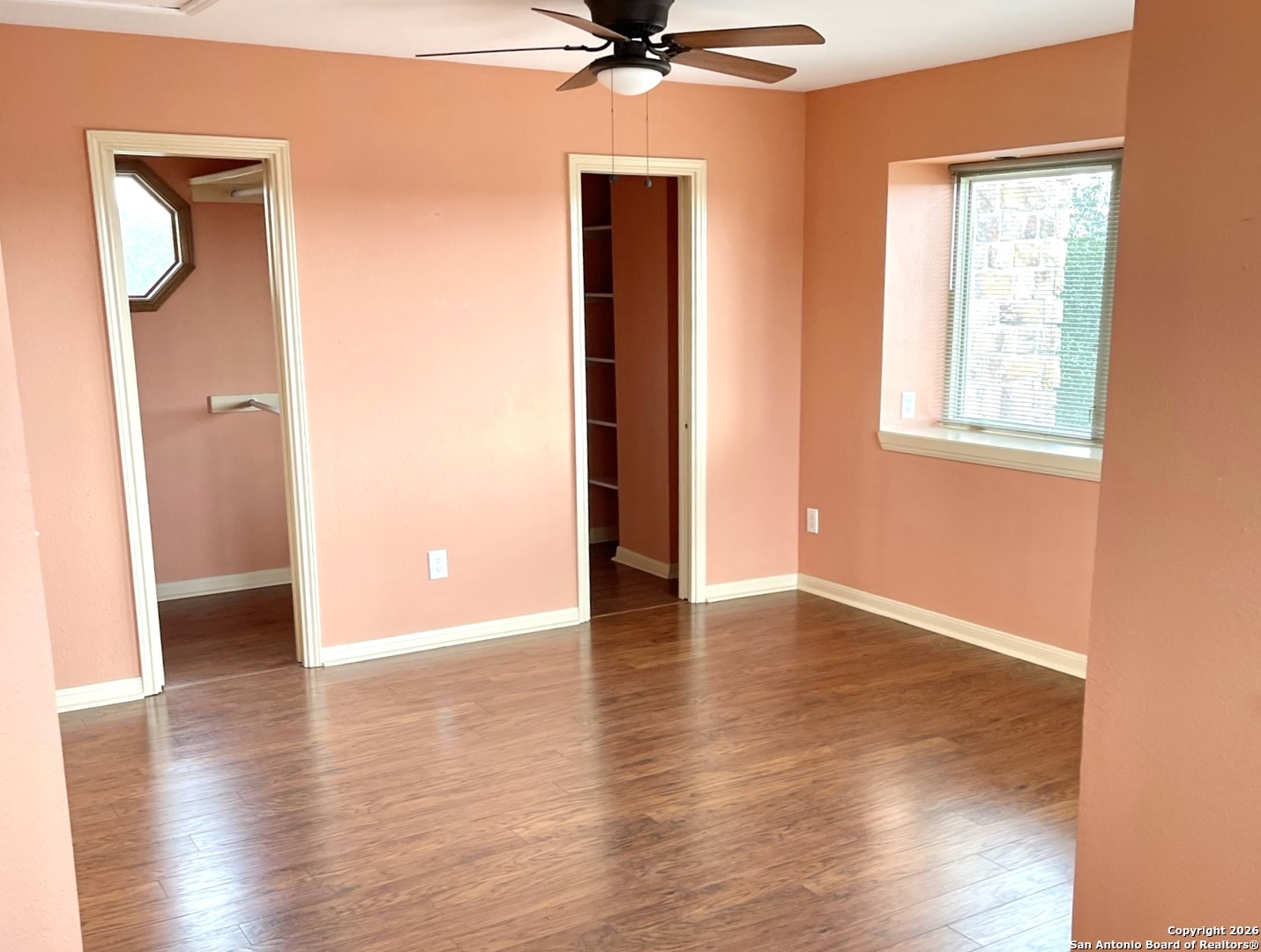 9623 Requa Road Helotes, TX 78023 - Photo 26 of 49 an empty room with wooden floor and a window