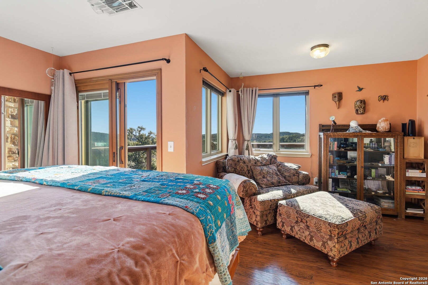 9623 Requa Road Helotes, TX 78023 - Photo 28 of 49 a bedroom with a bed window and walk in closet
