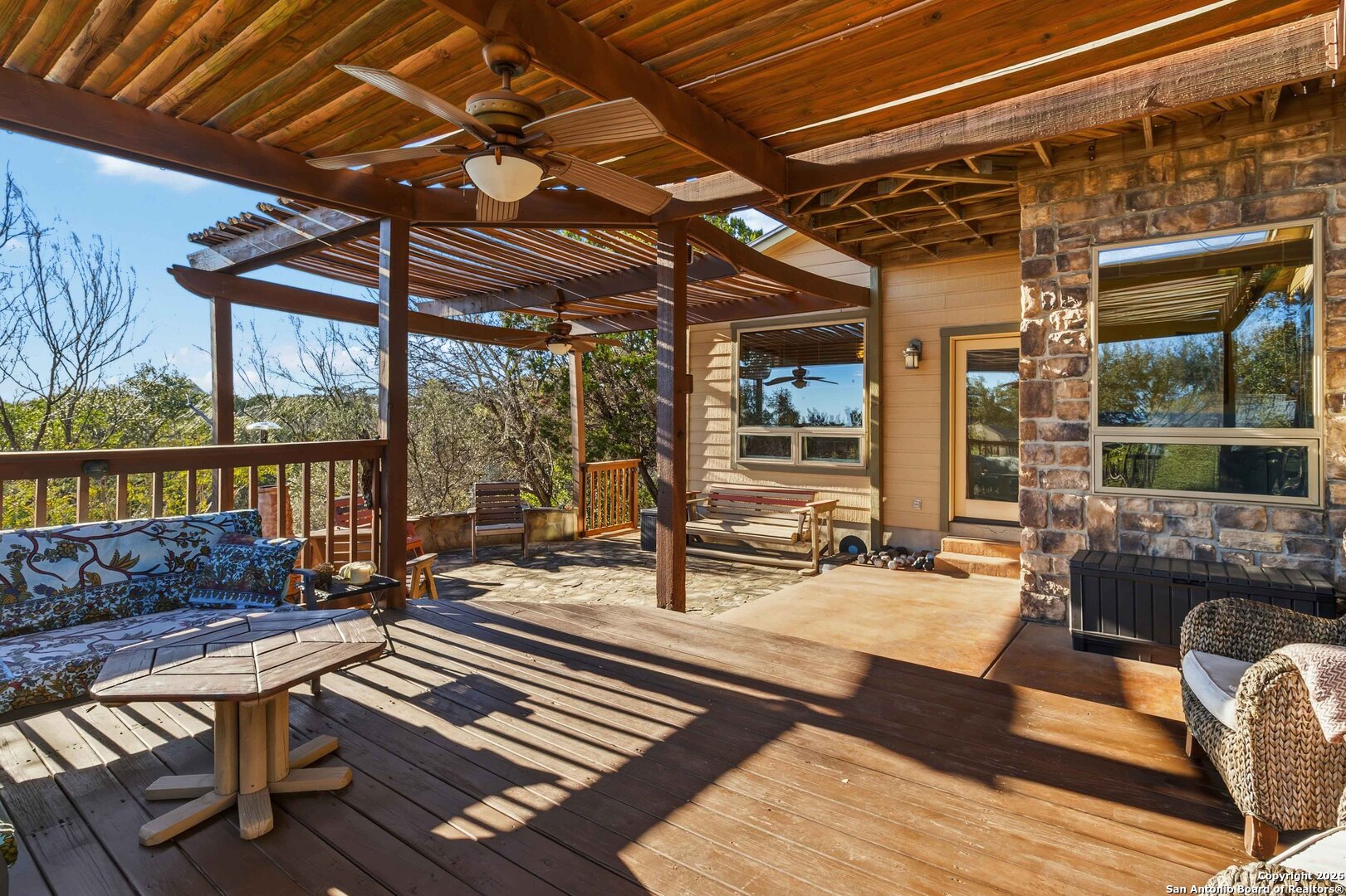 9623 Requa Road Helotes, TX 78023 - Photo 3 of 49 a building outdoor space with patio furniture and wooden floor