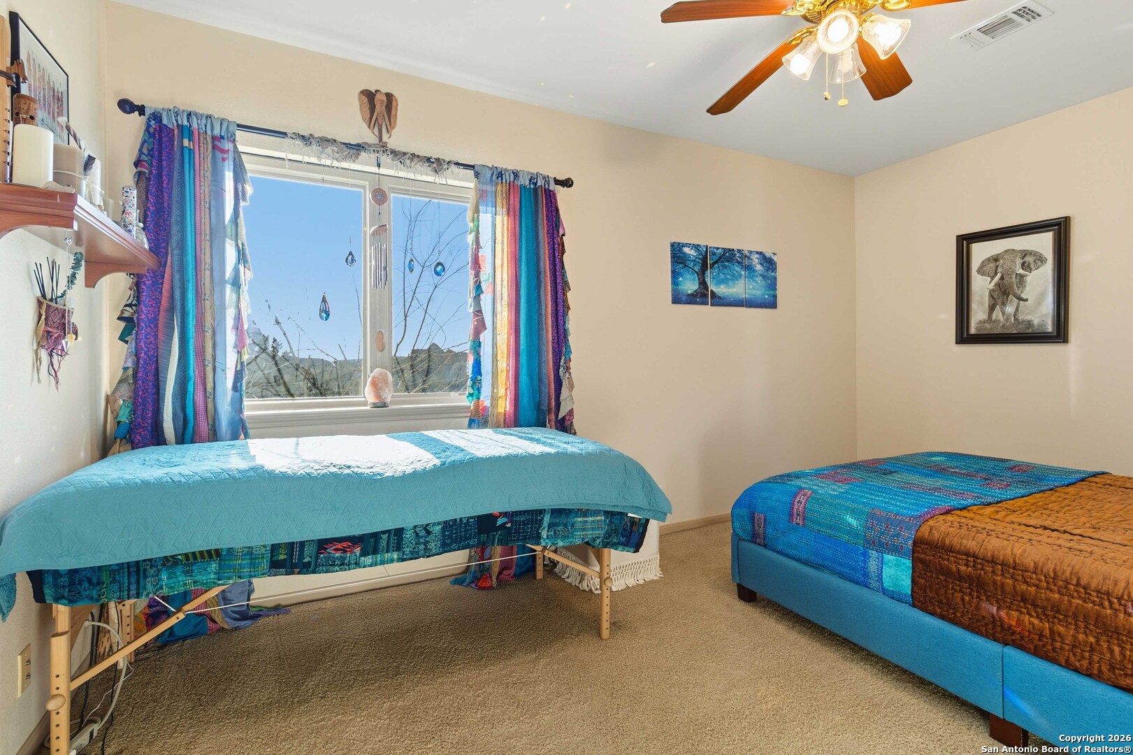 9623 Requa Road Helotes, TX 78023 - Photo 33 of 49 a bedroom with bed and a large mirror