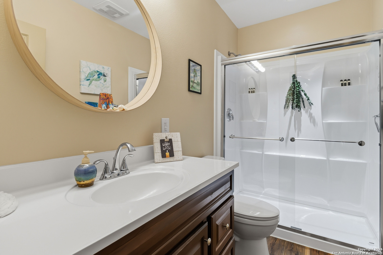 9623 Requa Road Helotes, TX 78023 - Photo 38 of 49 a bathroom with a sink a toilet and a mirror