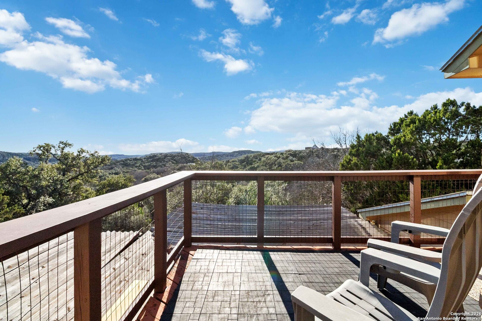 9623 Requa Road Helotes, TX 78023 - Photo 5 of 49 a view of balcony with wooden floor and fence
