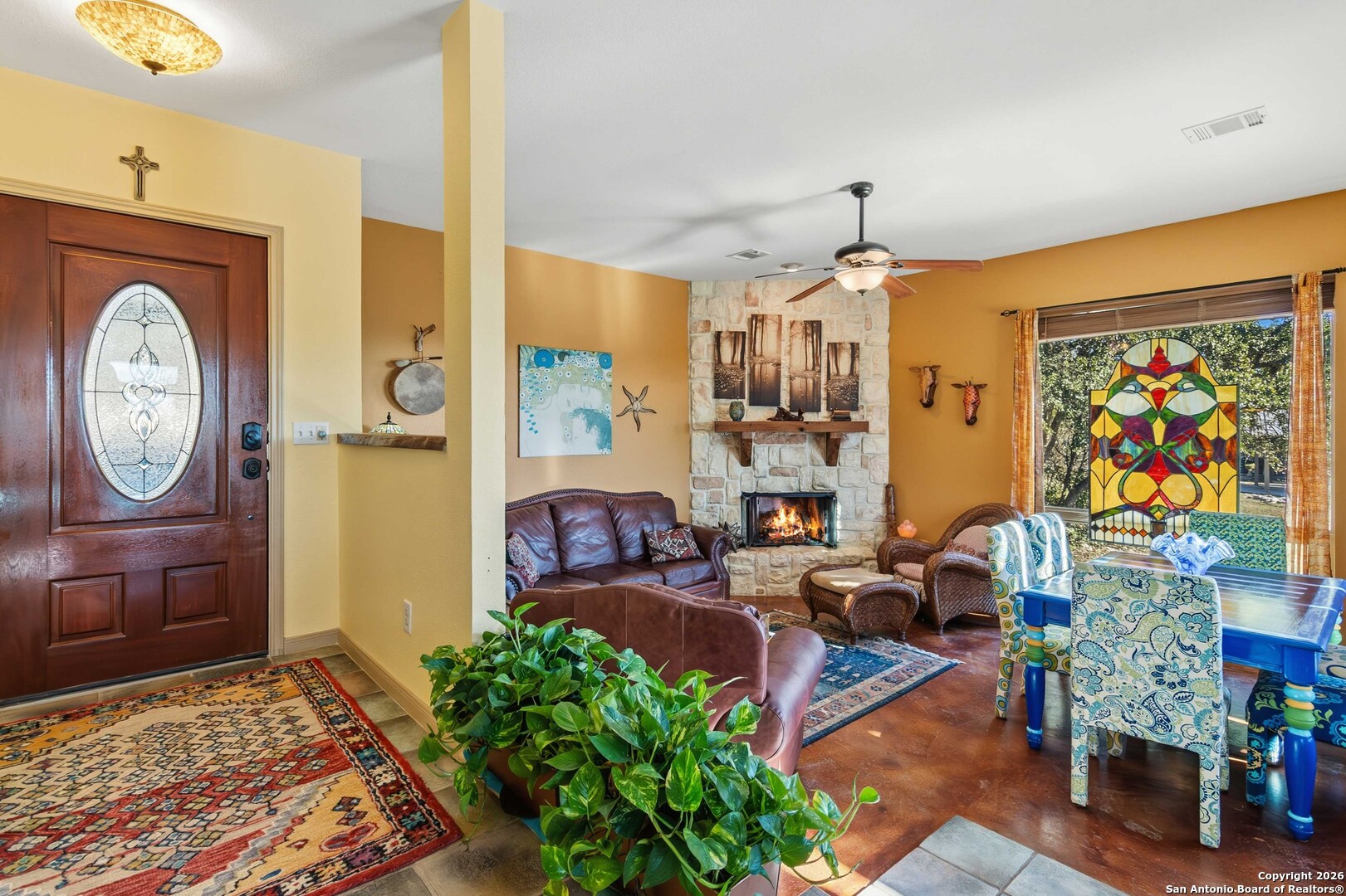9623 Requa Road Helotes, TX 78023 - Photo 8 of 49 a living room with furniture a rug and a clock