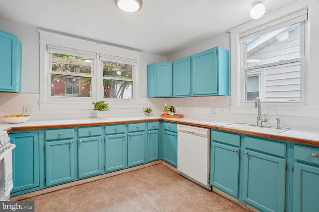 a kitchen with a sink and cabinets