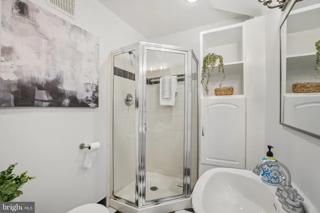 a bathroom with a shower and toilet