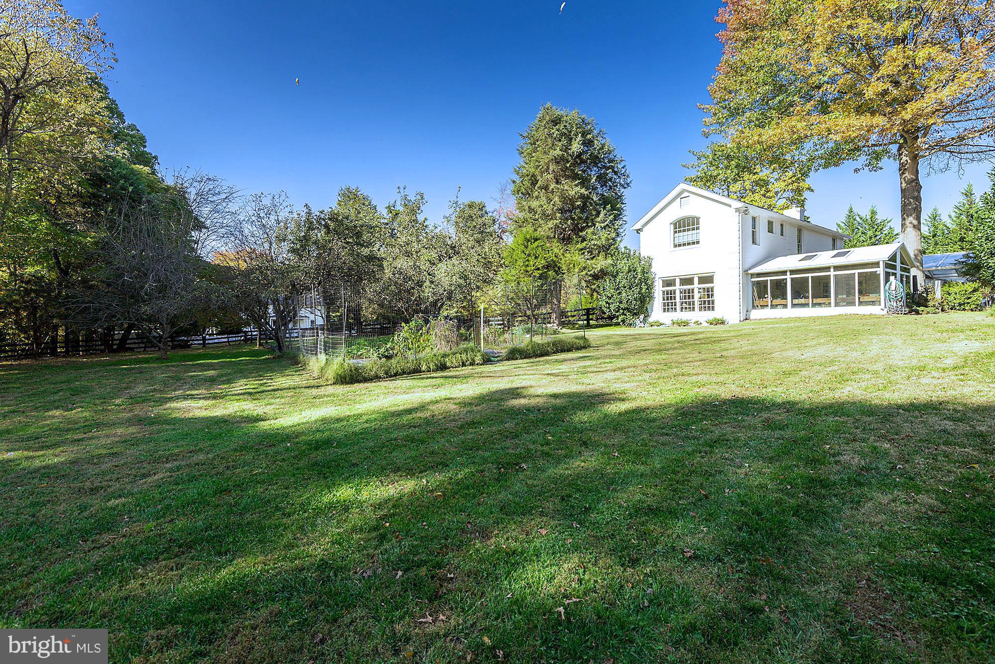 629 Springvale Road Great Falls, VA 22066 - Photo 3 of 26 Sunny garden by greenhouse side of house