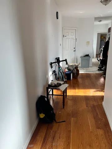 a view of wooden floor in an empty room