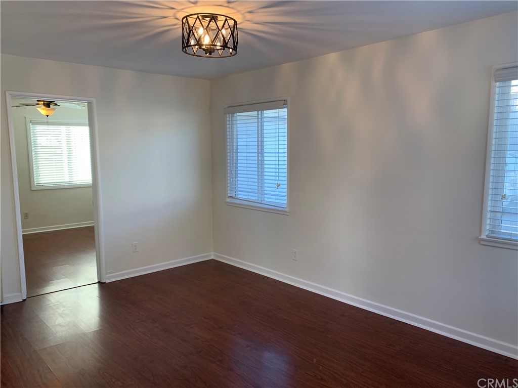 447 Martelo Avenue Pasadena, CA 91107 - Photo 5 of 24 a view of an empty room with wooden floor and a window