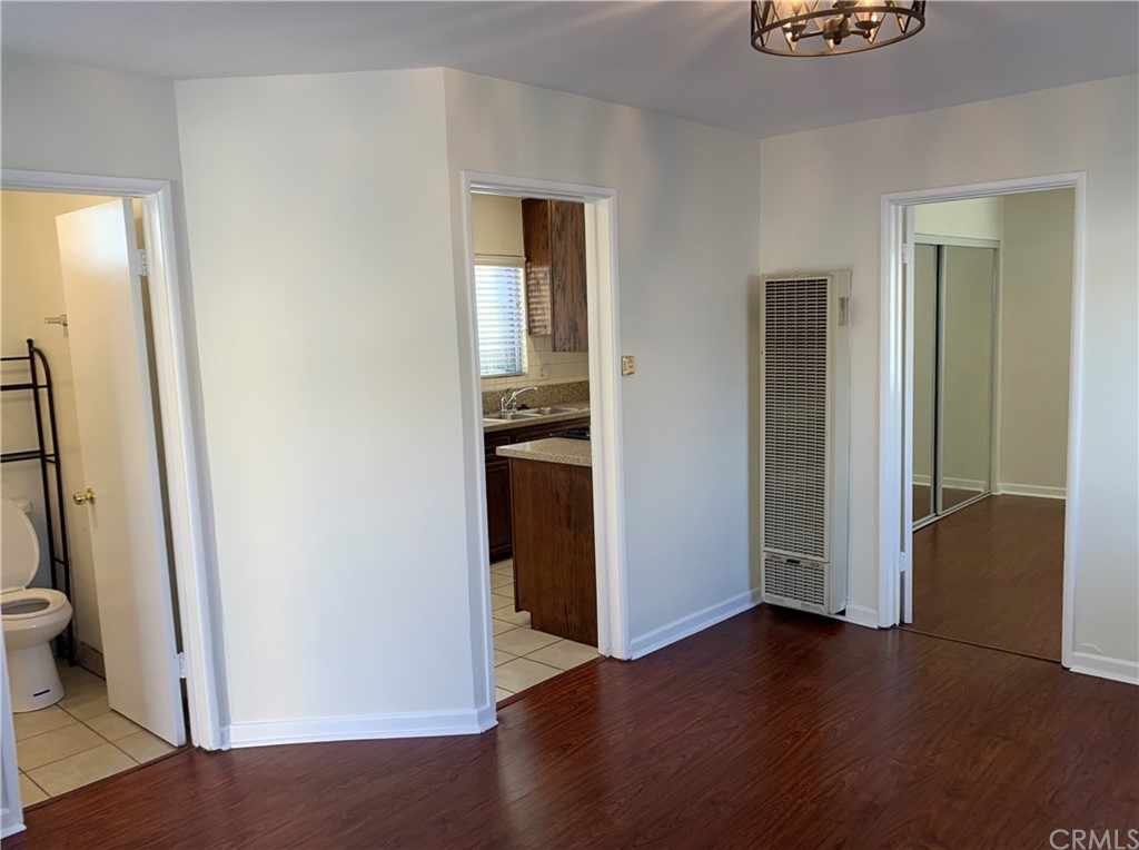 447 Martelo Avenue Pasadena, CA 91107 - Photo 7 of 24 an empty room with wooden floor and entrance