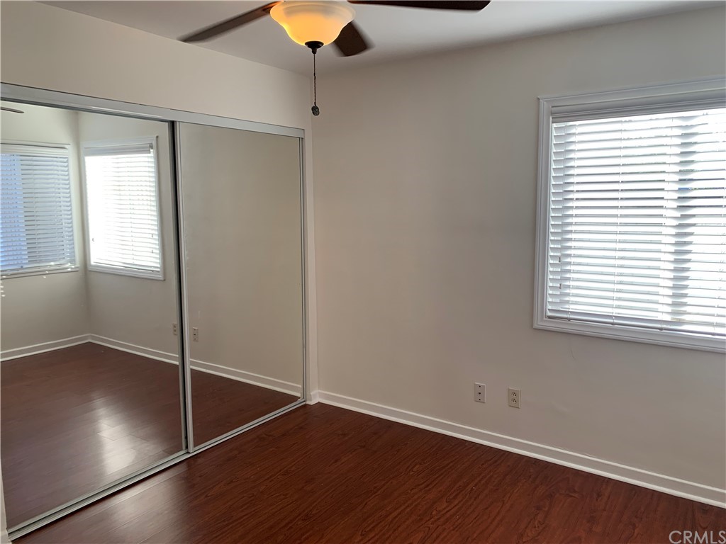 447 Martelo Avenue Pasadena, CA 91107 - Photo 10 of 24 an empty room with wooden floor fan and windows