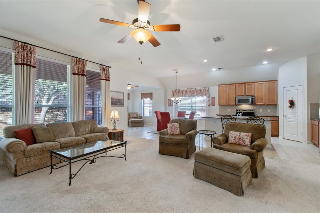 507 Scenic Ranch Circle Fairview, TX 75069 - Photo 1 of 1 a living room with furniture kitchen view and a large window