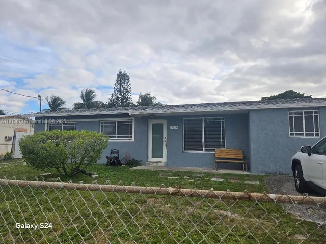 a house view with a garden space