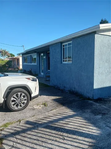a car parked in front of a house