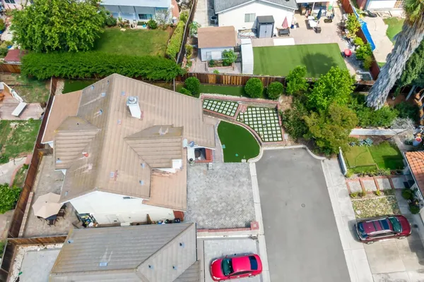 an aerial view of a house with a yard