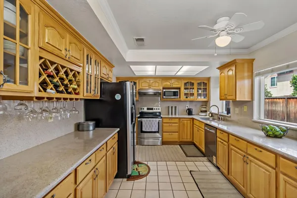 a kitchen with stainless steel appliances granite countertop a sink and cabinets