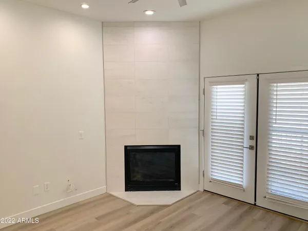 a view of a room with wooden floor