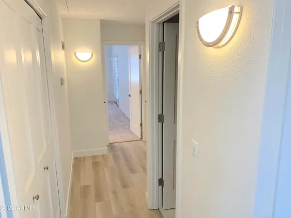 a bathroom with double vanity sink and mirror