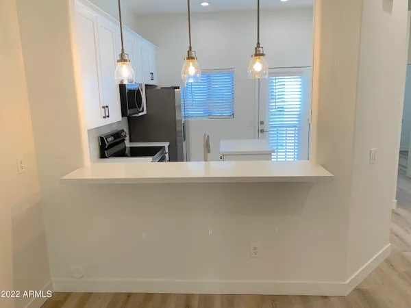 a view of a room that has a bed in it