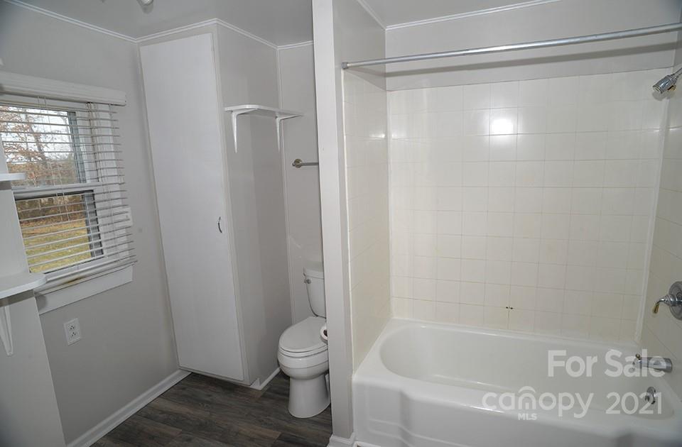 1220 Brison Road Woodleaf, NC 27054 - Photo 14 of 28 a bathroom with a bathtub and a toilet
